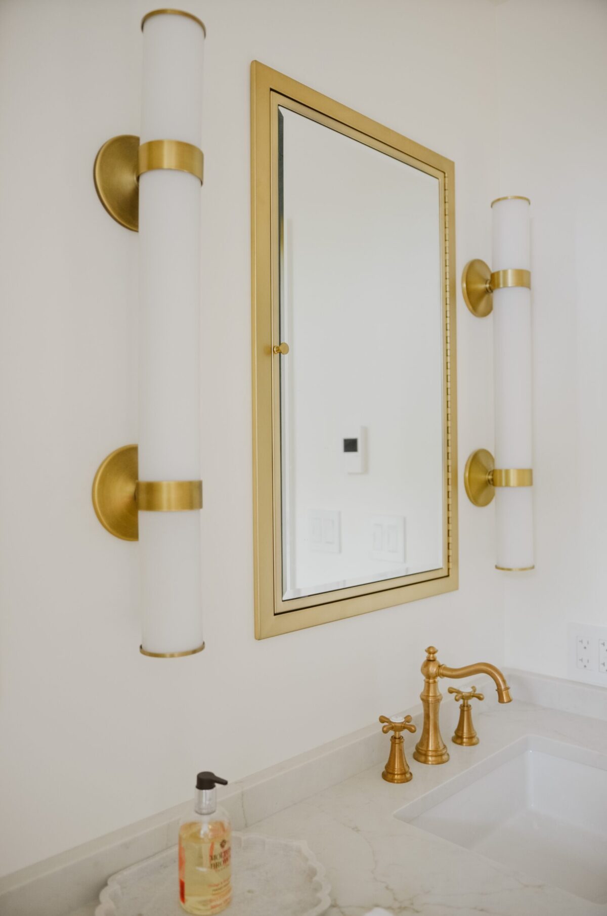 gold mirror in bathroom remodel