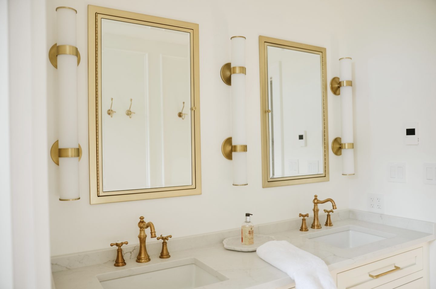 gold mirrors in modern bathroom