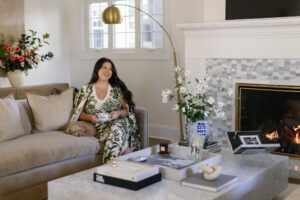 karissa in green sweater dress in living room