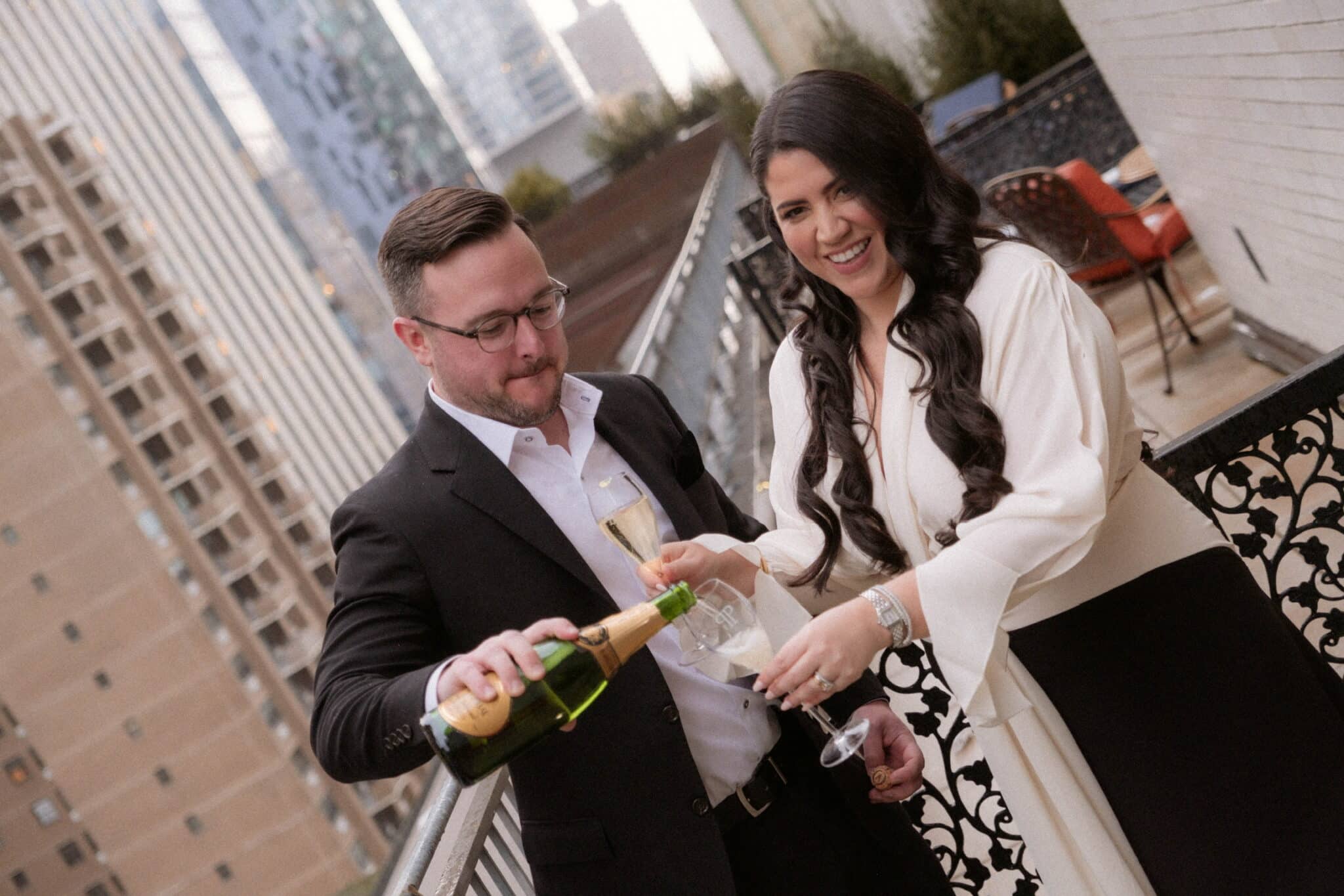 toasting wearing black and white formalwear