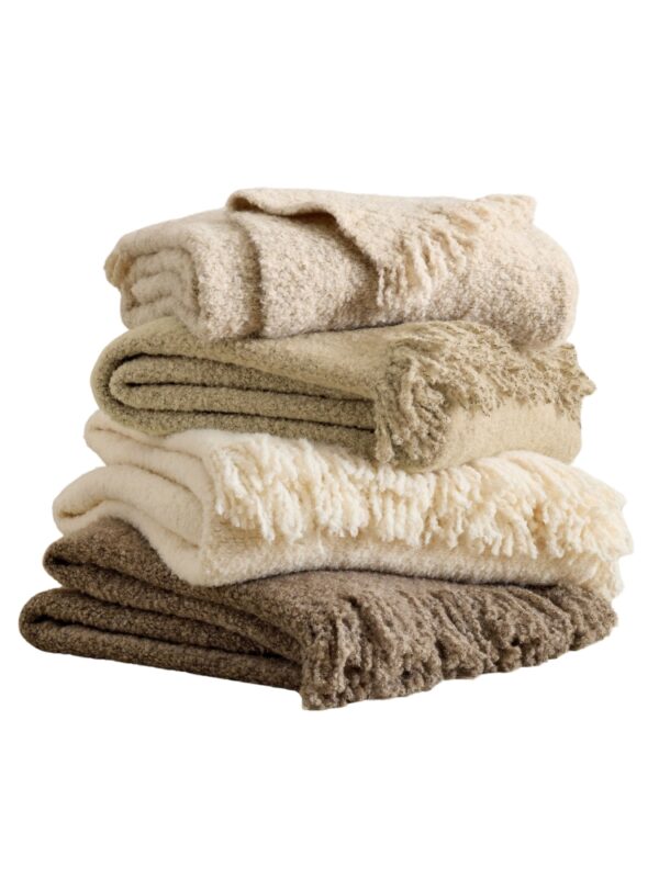 stack of cozy neutral throw blankets