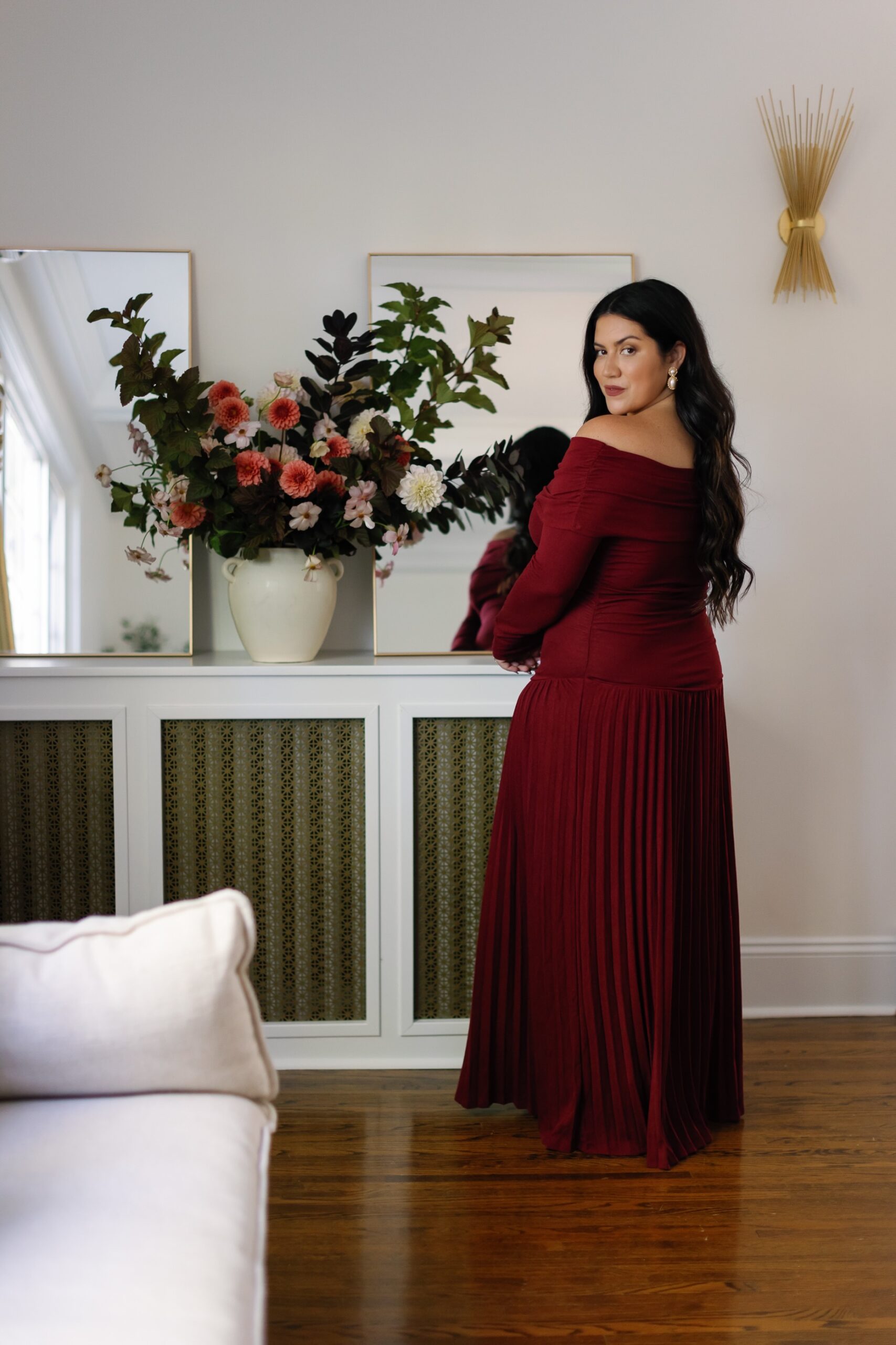 Burgundy holiday party outfits and winter flowers