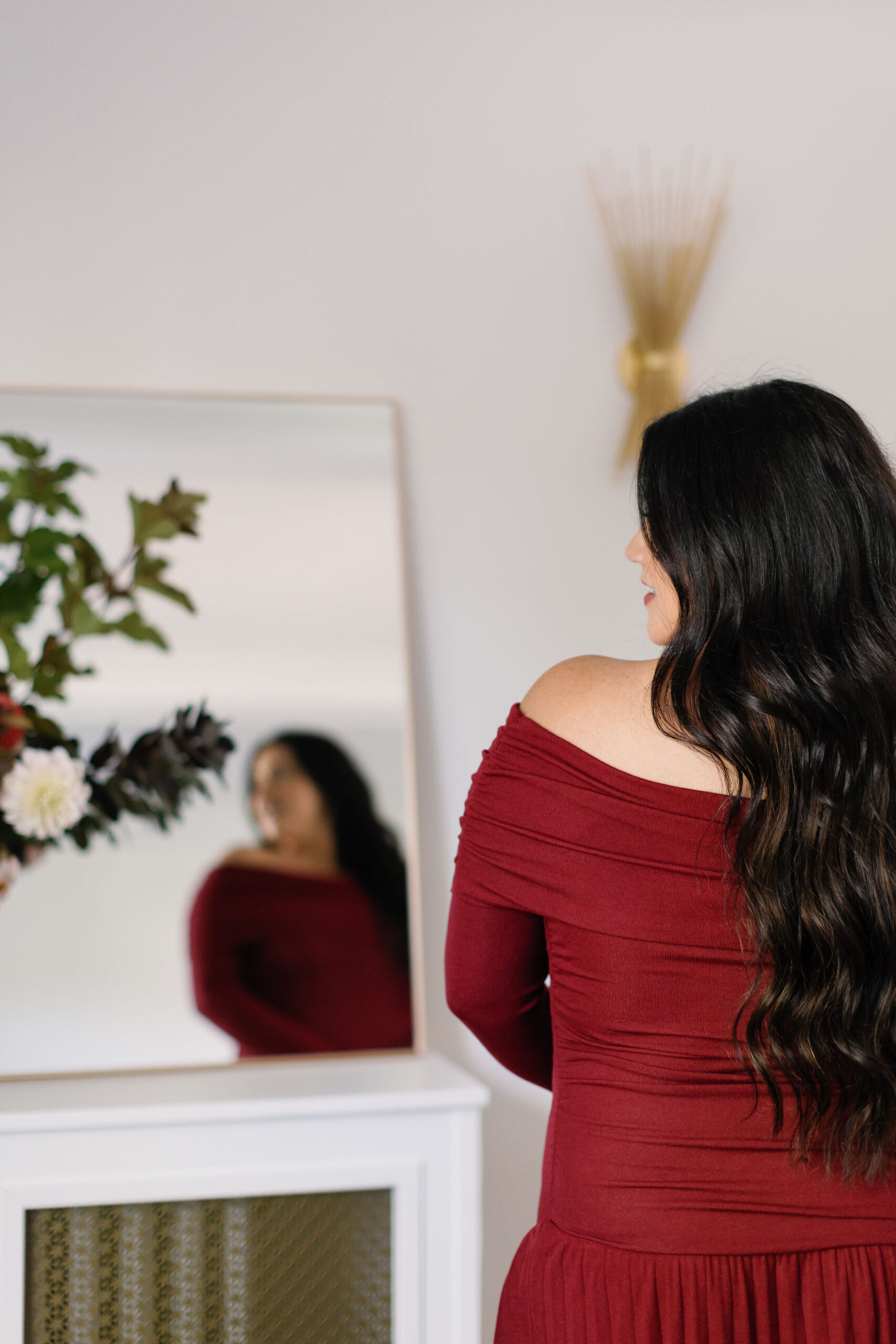 Burgundy holiday party outfits and winter flowers