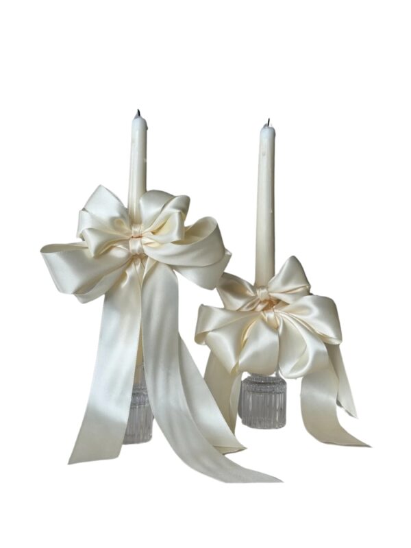 white bow taper candles