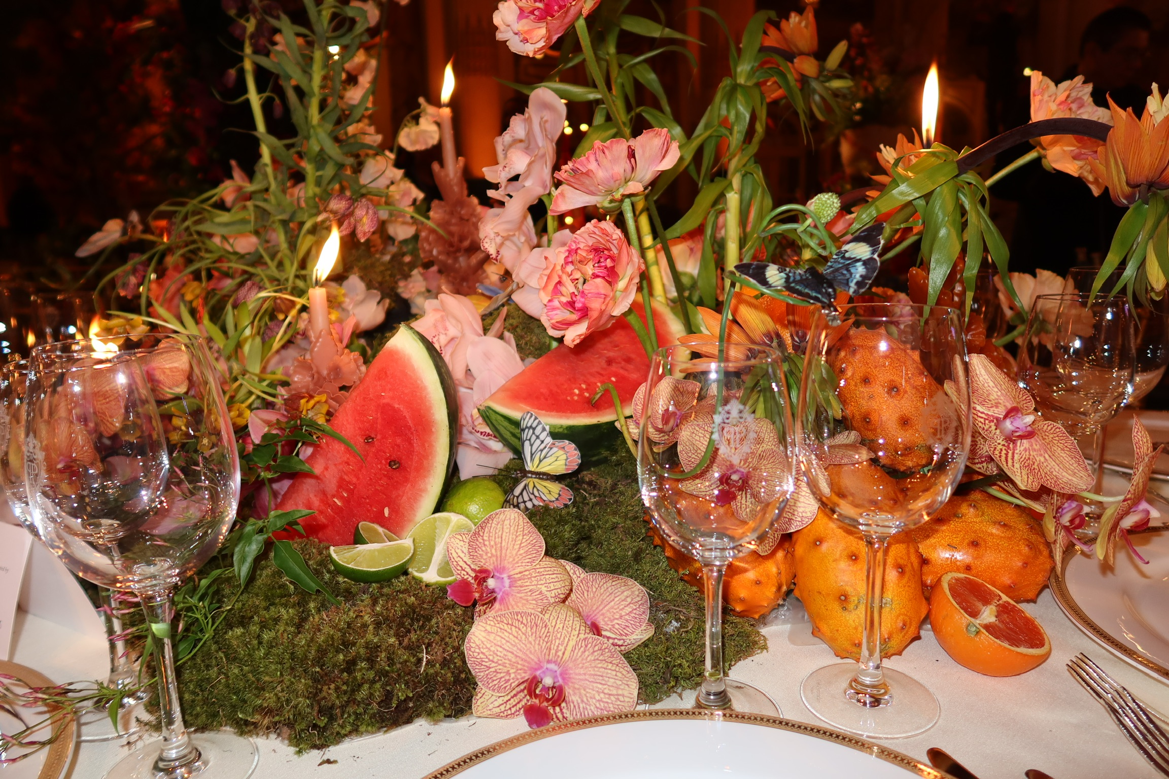 Mexican modern centerpiece with orchids and fruit