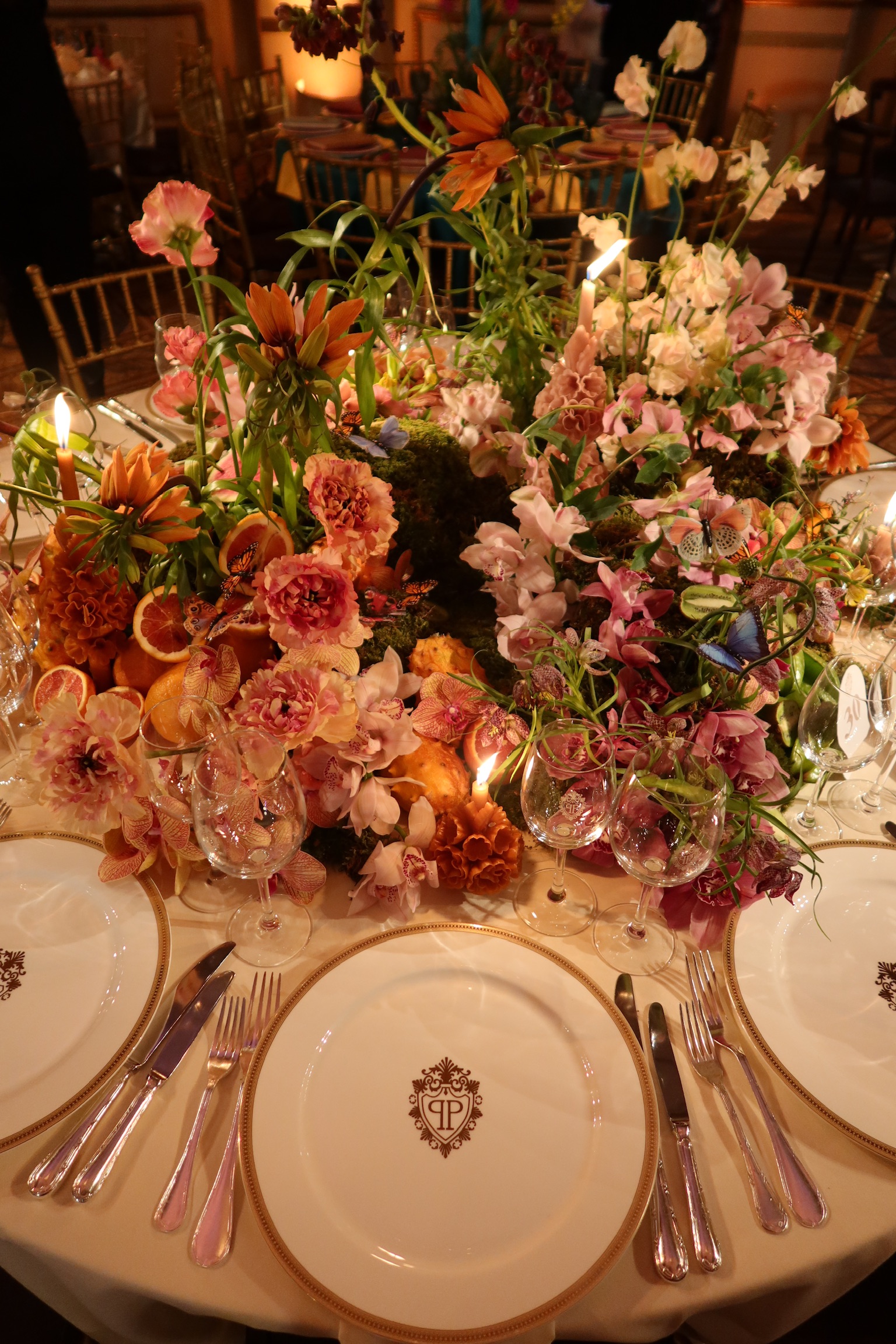 Mexican modern centerpiece with orchids and fruit