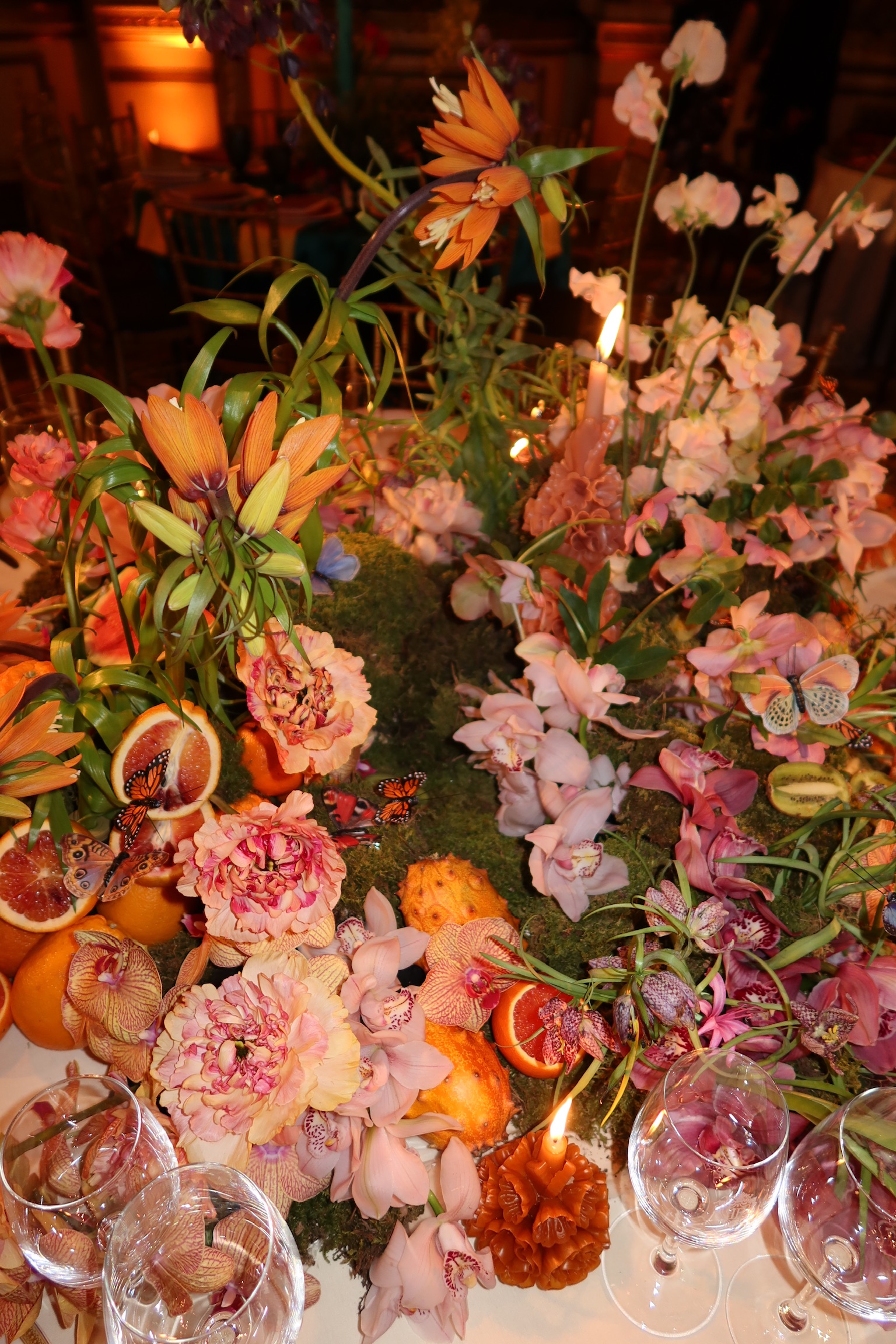 Mexican modern centerpiece with orchids and fruit